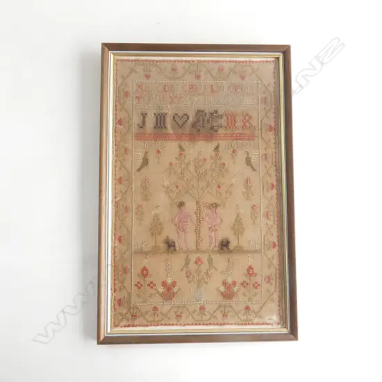 A framed antique Adam and Eve alphabet sampler, c.1829,  (some fading).  430 x 265mm